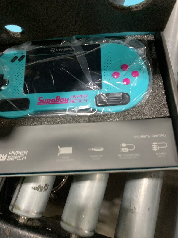 Photo 1 of Hyperkin SupaBoy Portable Pocket Console for SNES/SFC, Gaming console System - Super Nintendo Entertainment System (Super NES) / Super Famicom - (Hyper Beach)