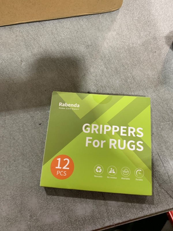 Photo 1 of Rabenda 12 Pcs Rug Tape, Non Slip Rug Pads Grippers for Hardwood Floors and Tiles, Reusable Carpet Tape for Area Rugs, Double-Sided Adhesive Rug Stickers Keep Corners Flat (Black)