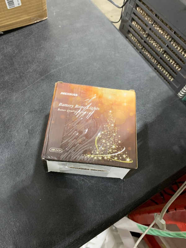 Photo 1 of JMEXSUSS 100 LED Battery Operated Rope Lights - Outdoor Waterproof, 33ft 8Mode Battery String Lights Outdoor with Remote for Trampoline, Camping, Balcony, Canopy, Deck Decor (White)