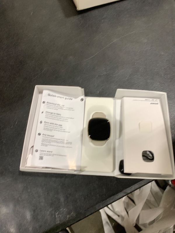 Photo 1 of Fitbit Sense Advanced Smartwatch with Tools for Heart Health, Stress Management & Skin Temperature Trends, White/Gold, One Size (S & L Bands Included)