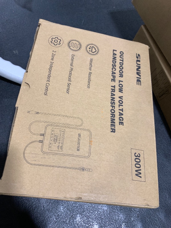 Photo 1 of SUNVIE 300W Low Voltage Landscape Transformer with 2 Independent Control Output Landscape Lighting Transformer with Timer and Photocell Sensor 120V AC to 12/14V AC Weatherproof Low Voltage Transformer