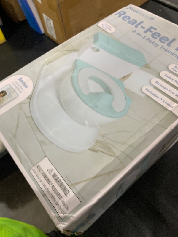 Photo 1 of Real Feel 2-in-1 Potty with Wipes Storage, Flushing Sounds & Disposable Liners - Realistic Toilet - Easy to Clean & Assemble - Jool Baby (Aqua)