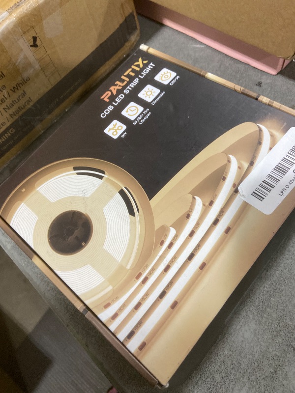 Photo 1 of PAUTIX COB LED Strip Lights with RF Remote,32.8ft UL Listed Dotless LED Lights Warm White 2700K,Super Bright Dimmable 24V Adhesive LED Tape Light,Kitchen Cabinets Shelf Mirror Office Bedroom Lighting