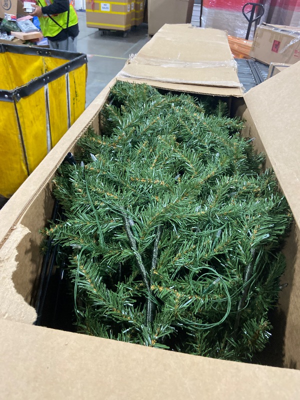 Photo 1 of National Tree Company 7.5 ft Pre-Lit Dunhill Fir Artificial Christmas Tree, 700 LED Lights, 2,514 Tips, Foot Pedal, 10 Light Functions, Includes Stand, Green