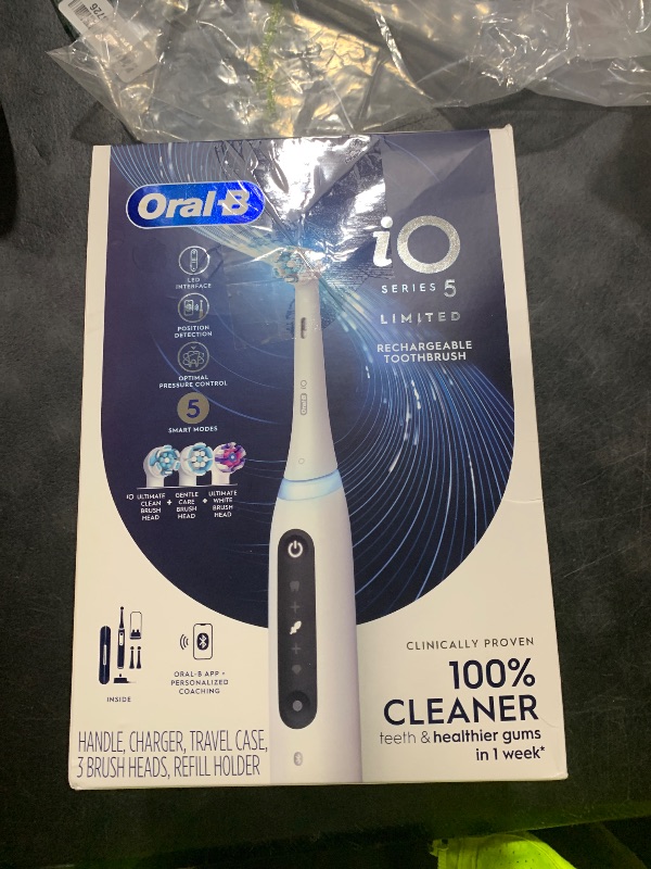 Photo 1 of Oral-B iO Deep Clean + Whiten Rechargeable Electric Toothbrush with Visible Pressure Sensor, 2 Minute Timer, 5 Cleaning Settings, 1 iO5 Limited, 3 Toothbrush Heads, Travel Case & Refill Holder, White