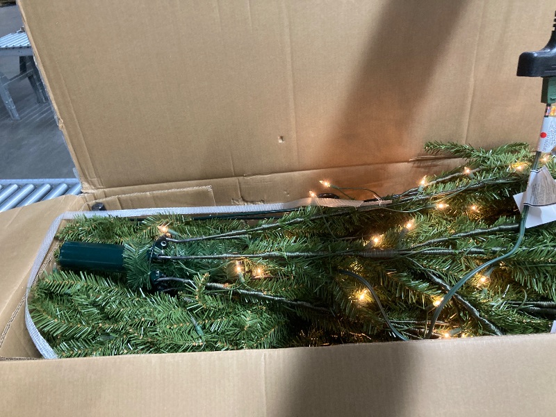 Photo 1 of *Plug is bent slightly but works* National Tree Company 12 ft Pre-Lit Dunhill Fir Artificial Christmas Tree, 1,500 Clear Lights, 7,794 Tips, Includes Stand, Green