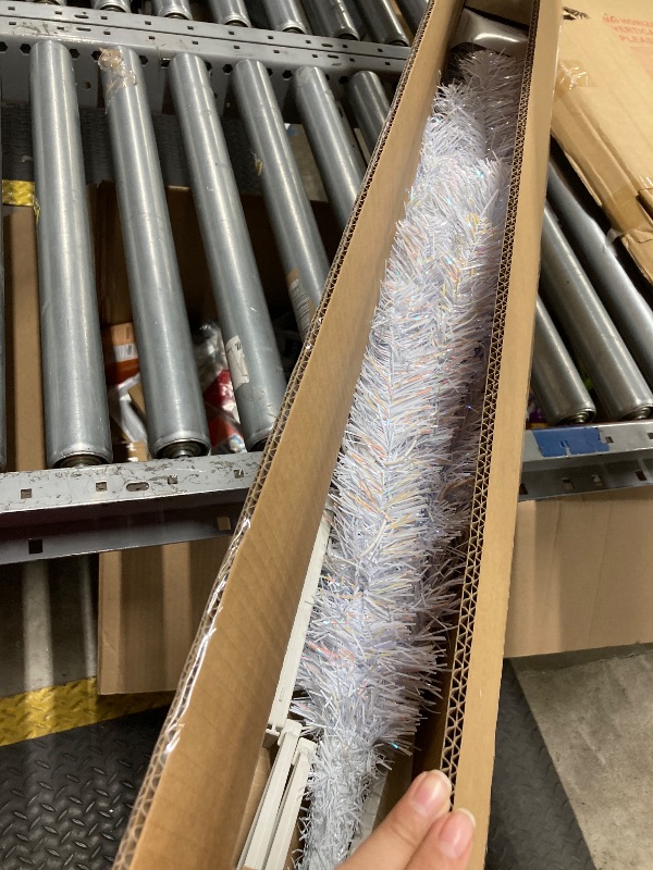 Photo 1 of ***DAMAGE -SELLING AS IS***  National Tree Company 4 ft Pre-Lit Mini Artificial Christmas Tree, White Iridescent Tinsel, 70 Clear Lights, 110 Tips, Includes Stand