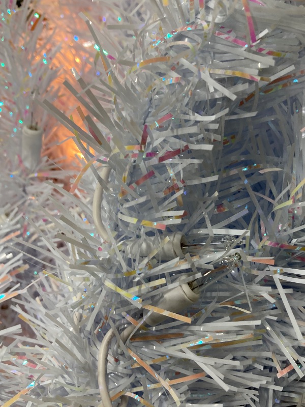 Photo 1 of ***DAMAGE -SELLING AS IS***  National Tree Company 4 ft Pre-Lit Mini Artificial Christmas Tree, White Iridescent Tinsel, 70 Clear Lights, 110 Tips, Includes Stand