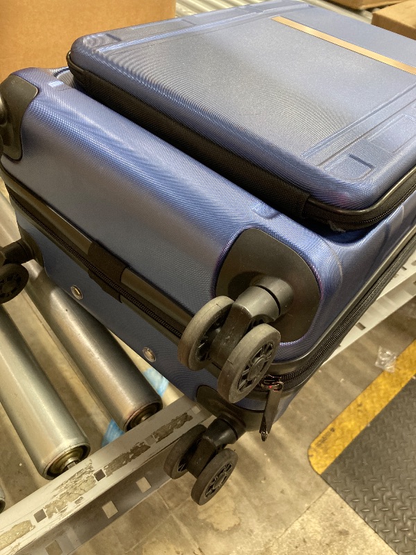 Photo 1 of 
USED ??BLUE SUITCASE WITH SOME DAMAGE