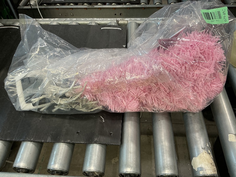 Photo 1 of  pink artificial Christmas tree with solar-powered LED string lights