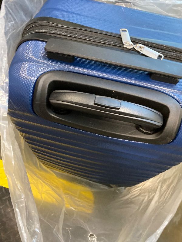 Photo 1 of **MINOR DAMAGE**Amazon Basics 21" Hardside Carry-On Luggage, Hardshell Suitcase With Wheels, Expandable For Up to 25% More Space, With Scratch-Resistant Surface, Four Multi-directional Wheels, Navy Blue