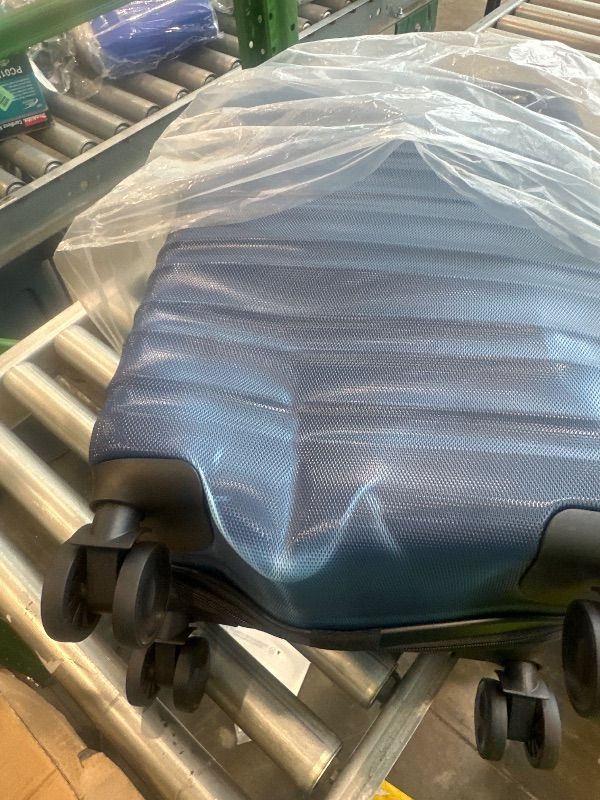 Photo 1 of **MINOR DAMAGE**Amazon Basics 21" Hardside Carry-On Luggage, Hardshell Suitcase With Wheels, Expandable For Up to 25% More Space, With Scratch-Resistant Surface, Four Multi-directional Wheels, Navy Blue