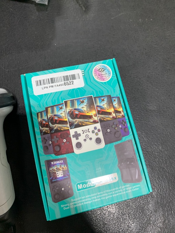 Photo 1 of ?R36MAX 4000mAh Portable Rechargeable Handheld Retro Game Console,Comfort Non-Slip Handheld Standing Retro Game Console with 64G TF Car,4.0-inch Screen,for Office,Black