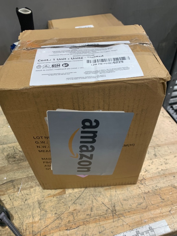 Photo 1 of Amazon Basics Ceramic Space Heater, Portable Indoor Heating Solution, With Overheat and Tip-Over Protection, Thermostat, Non-Oscillating, 1500W, 7.52"D x 6.34"W x 9.45"H, Black