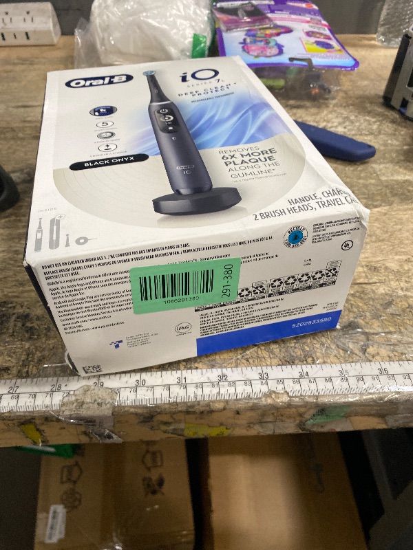 Photo 1 of **FACTORY SEALED**Oral-B iO Deep Clean + Protect Rechargeable Electric Toothbrush, Black with a iO Series 7 Toothbrush, 2 Replacement Brush Heads, and a Charging Travel Case