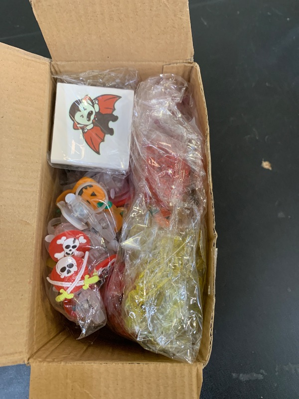 Photo 1 of 100 PCS Halloween Party Favors for Kids, Halloween Glow in The Dark Toys Bulk Party Supplies Light Up Rotating Necklace LED Ring Halloween Goodie Bag Fillers Treats for Classroom Prizes Trick or Treat