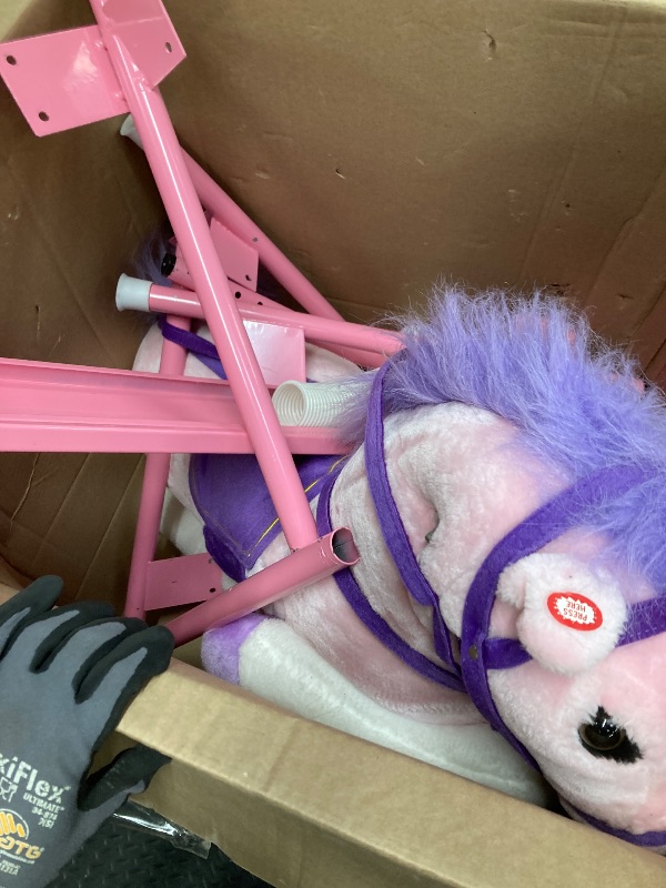 Photo 1 of *Scratches* Spring Rocking Horse - Plush Bouncy Ride-On Toy with Fun Sounds, Wood Handles, and Adjustable Stirrups for Kids Ages 3 to 6 by Happy Trails (Pink)
