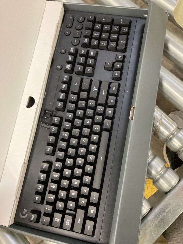 Photo 1 of ***DAMAGE -SELLING AS IS*** Logitech G213 Prodigy Gaming Keyboard - Wired RGB Backlit Keyboard with Mech-Dome Keys, Palm Rest, Adjustable Feet, Media Controls, USB, Compatible with Windows – Black