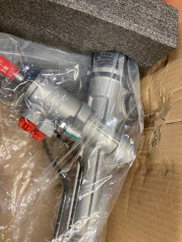 Photo 1 of  steering rack assembly, protective gloves, and a user manual. 