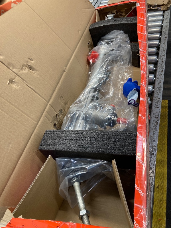 Photo 1 of  steering rack assembly, protective gloves, and a user manual. 