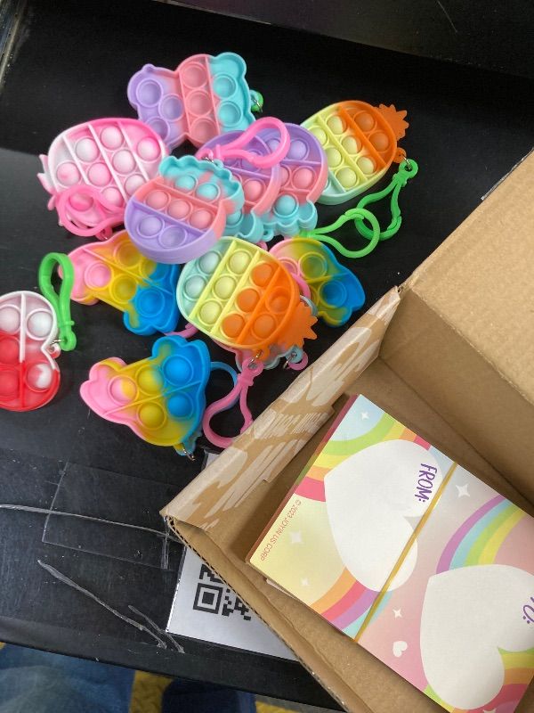 Photo 1 of ***MISSING PIECES -SELLING AS IS ***JOYIN 30 Packs Valentine‘s Day Gift Cards with 12 ONLY Pop Bubble Keychains, 6 Designs Mini Colored Pop, Multi-Shape Stress Relief Fidget Toys for Kids Valentine's Party Favors and Classroom Gift Exchange