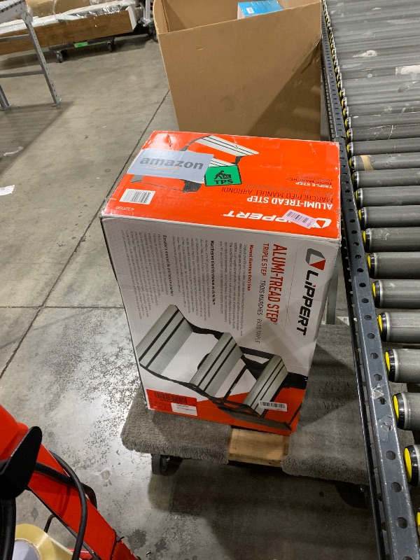 Photo 1 of Lippert Components 432696 Alumi-Tread Triple Manual Step , Black