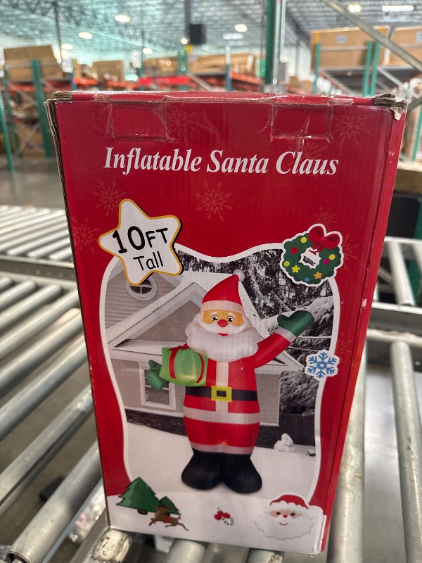 Photo 1 of 10 FT Christmas Inflatable Santa Claus Outdoor Decorations, Blow Up Santa Claus Holding Gift Box for Xmas Outside Decor, Giant Santa with Bright LED Lights for Yard Patio Garden Lawn Holiday Party