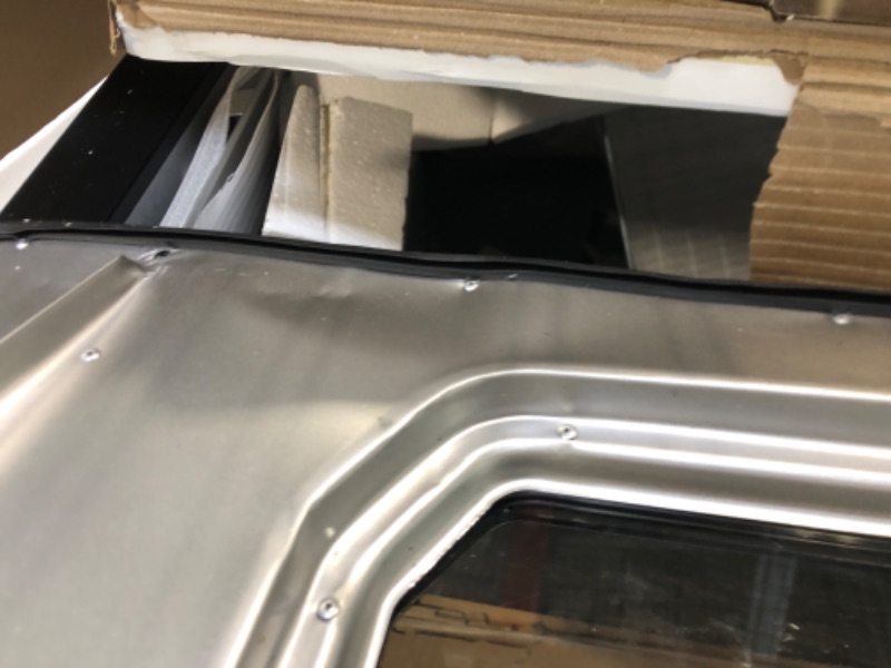 Photo 1 of ***HAS DENTS COMING OFF THE HNGES ***Masterbuilt® 40-inch Digital Electric Vertical BBQ Smoker with Leg Kit, Side Wood Chip Loader and 970 Cooking Square Inches in Black, Model MB20070122