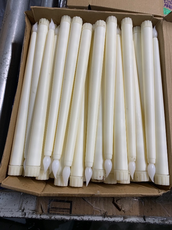 Photo 1 of ***(HEAVILY USED/ MINOR DAMAGE)***Treela 36 Pieces Flameless Taper Candles 11 Inch Flickering Faux LED Battery Operated Electric Fake Candles for Christmas Halloween Birthday Wedding Party Supplies(Ivory)
