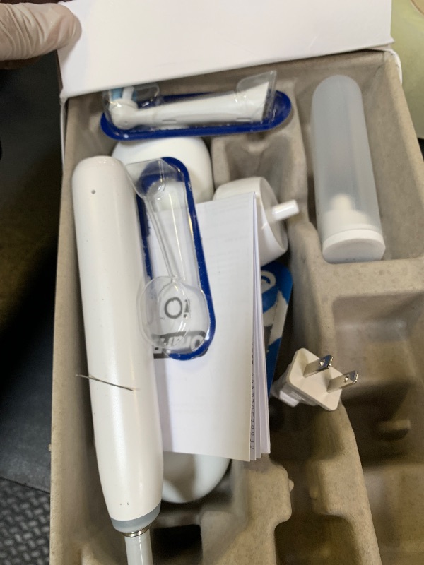 Photo 1 of Oral-B iO Deep Clean + Whiten Rechargeable Electric Toothbrush with Visible Pressure Sensor, 2 Minute Timer, 5 Cleaning Settings, 1 iO5 Limited, 3 Toothbrush Heads, Travel Case & Refill Holder, White