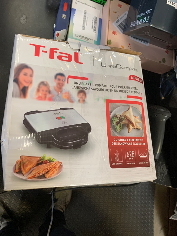 Photo 1 of **USED, DAMAGED** T-fal Compact Sandwich Maker, Stainless Steel, Easy to Clean, Indicator Lights, Cool Touch Handle, Grilled Cheese, Panini, 625 Watts, Black
