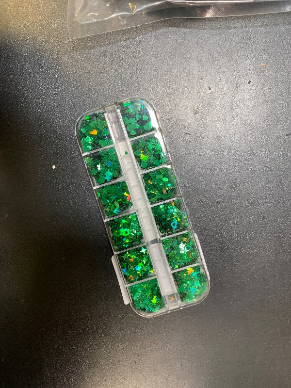 Photo 1 of 1 Box Holographic St. Patrick's Day Nail Glitter Shamrock Clover Nail Sequins 3D Green Nail Flakes Sparkly Glitter Flakes Shiny Nail Glitter Hearts Star Nail Sequins Glitter for Nails Art 12 Grids