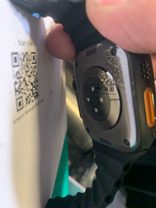 Photo 1 of Apple Watch Ultra 2 (GPS + Cellular, 49MM) - Black Titanium Case with Black Ocean Band (Renewed Premium)