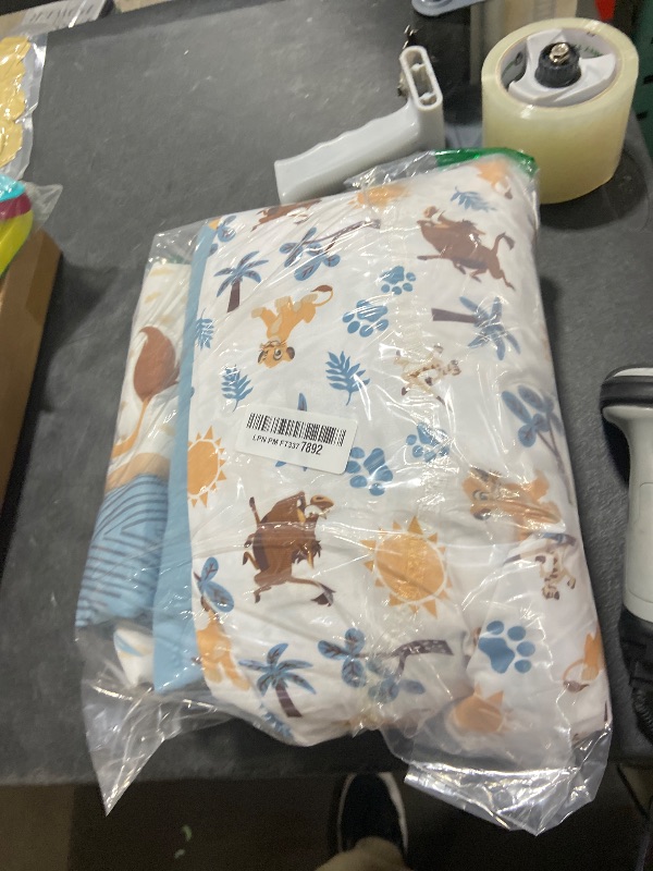 Photo 1 of Lambs & Ivy (LAMCR) Lion King Adventure 3-Piece Mini Crib Bedding Set, Blue (790020)