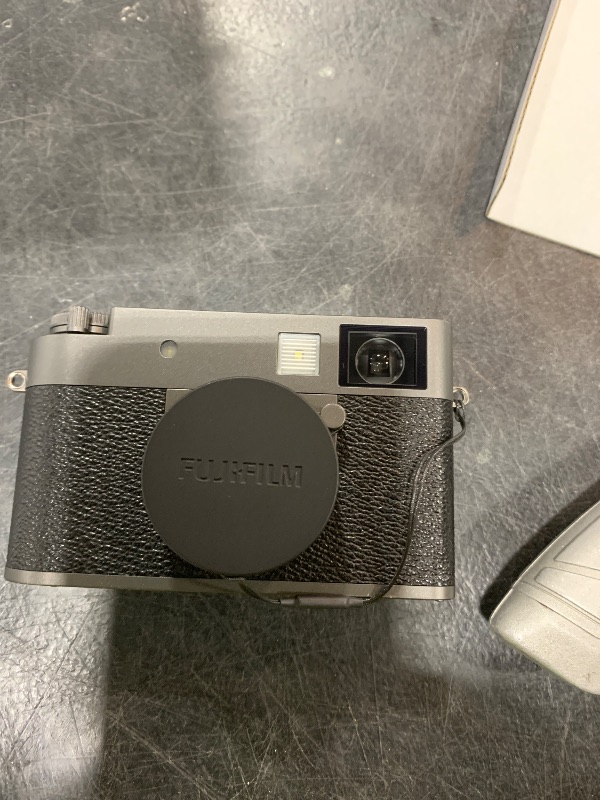 Photo 1 of FUJIFILM X Half Premium Compact Digital Camera (Charcoal Silver) Bundle with Carrying Case + 64GB Memory Card + Lens Cap Keeper + Memory Card Wallet + Hand Strap + More