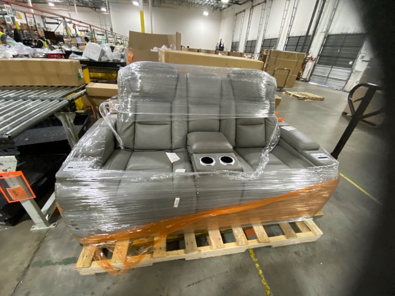 Photo 1 of Signature Design by Ashley The Man-Den Leather Power Reclining Loveseat with Center Console, Adjustable Headrest & Wireless Charging, Gray