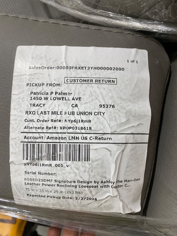 Photo 1 of Signature Design by Ashley The Man-Den Leather Power Reclining Loveseat with Center Console, Adjustable Headrest & Wireless Charging, Gray