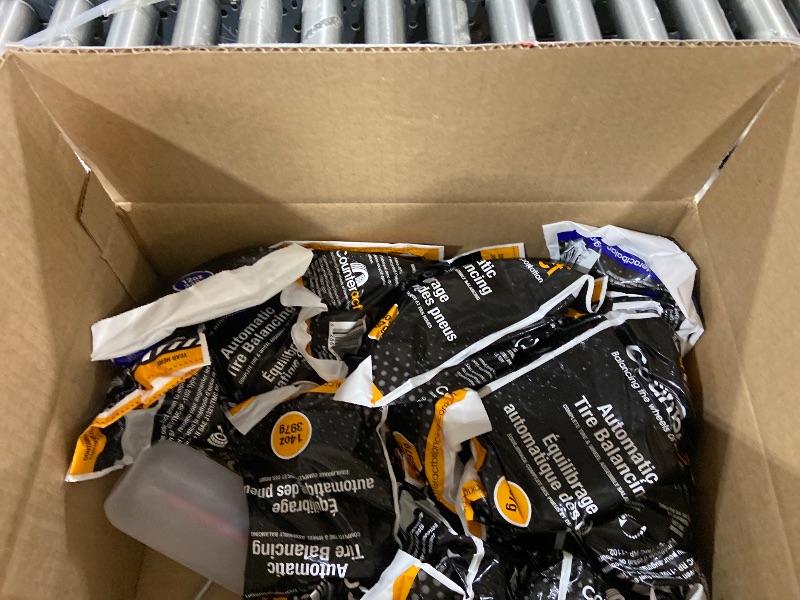 Photo 1 of Counteract DIYK-TT Do It Yourself Tire/Wheel Balancing Beads Tractor/Trailer Kit - (2) 12oz, (16) 14oz Bead Bags, (18) Valve Caps and Cores, (18) Flow-Through Caps, (1) Core Remover, Injector Bottle