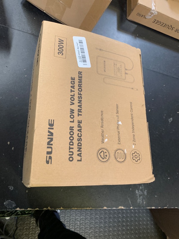 Photo 1 of SUNVIE 300W Low Voltage Landscape Transformer with 2 Independent Control Output Landscape Lighting Transformer with Timer and Photocell Sensor 120V AC to 12/14V AC Weatherproof Low Voltage Transformer