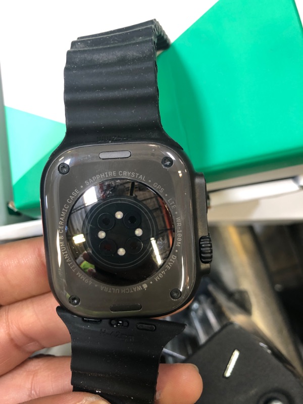 Photo 1 of Apple Watch Ultra 2 (GPS + Cellular, 49MM) - Black Titanium Case with Black Ocean Band (Renewed Premium)