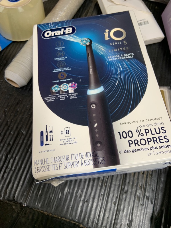 Photo 1 of Oral-B Rechargeable Electric Toothbrush, iO5 Limited Deep Clean & Whiten, 5 Cleaning Modes, Visual Pressure Sensor to Protect Gums, Travel Case, 3 Brush Heads, Black