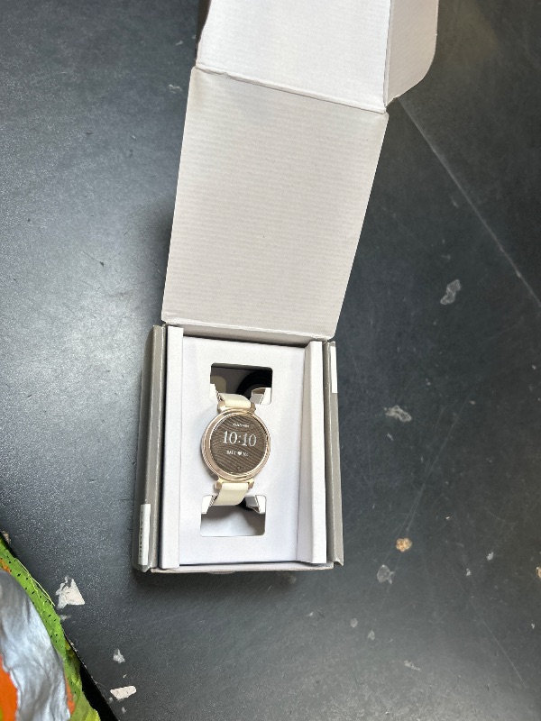 Photo 1 of Garmin Lily 2, Small and Stylish Smartwatch, Hidden Display, Patterned Lens, Up to 5 Days Battery Life, Coconut