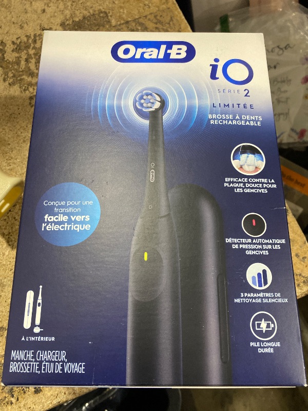 Photo 1 of **DOESNT CHARGE** Oral-B Rechargeable Electric Toothbrush, iO Limited Simple Clean, 3 Cleaning Modes, Automatic Pressure Sensor to Protect Gums, Travel Case, Night Black