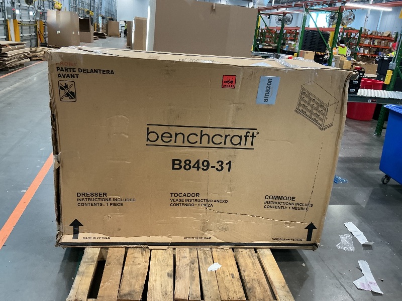 Photo 1 of **USED*Signature Design by Ashley Taffenbrook Farmhouse 10-Drawer Bedroom Dresser with Felt-Lined Top Drawer for Jewelry and Delicates, Easy Glide Drawers, Picture Frame Moulding, Black Handles, Dark Brown