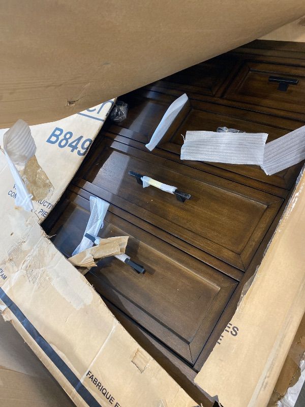 Photo 1 of **USED*Signature Design by Ashley Taffenbrook Farmhouse 10-Drawer Bedroom Dresser with Felt-Lined Top Drawer for Jewelry and Delicates, Easy Glide Drawers, Picture Frame Moulding, Black Handles, Dark Brown