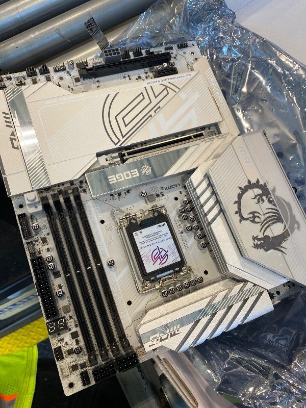 Photo 1 of *UNTESTED -See clerk notes*
MSI MPG Z890 Edge TI WiFi Gaming Motherboard (Support Core Ultra Series 2 Intel Processors, LGA 1851, DDR5, PCIe 5.0, M.2, SATA, 5Gbps LAN, USB Type-C, Wi-Fi 7, Bluetooth 5.4, Thunderbolt 4, ATX)
