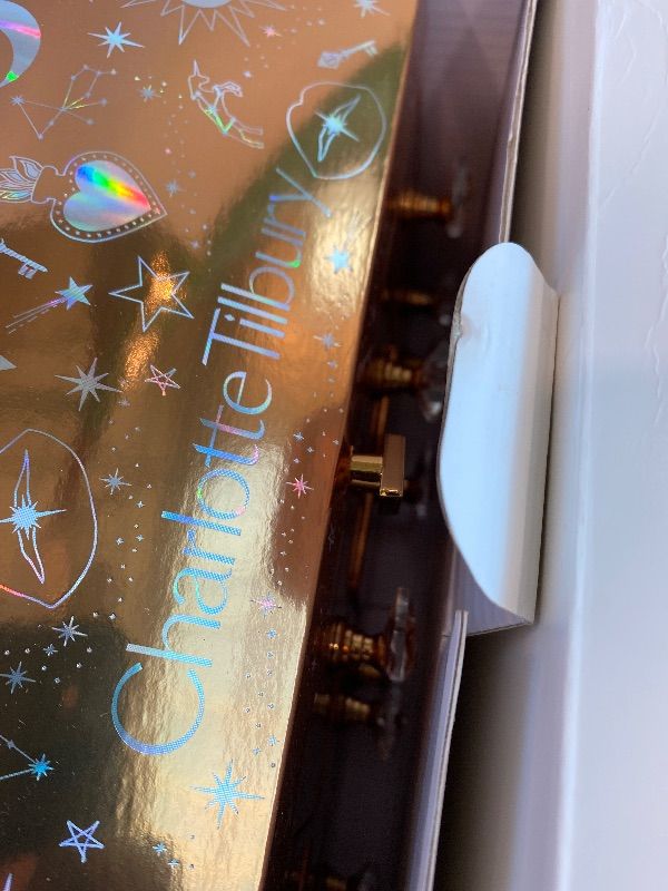 Photo 1 of ***Empty****Charlotte Tilbury Beauty Treasure Chest Advent Calendar - 12-Piece Makeup Gift Set with Full-Size Icons & Travel Minis - Includes Skincare, Lip, Cheek & Eye Makeup (12 Count)