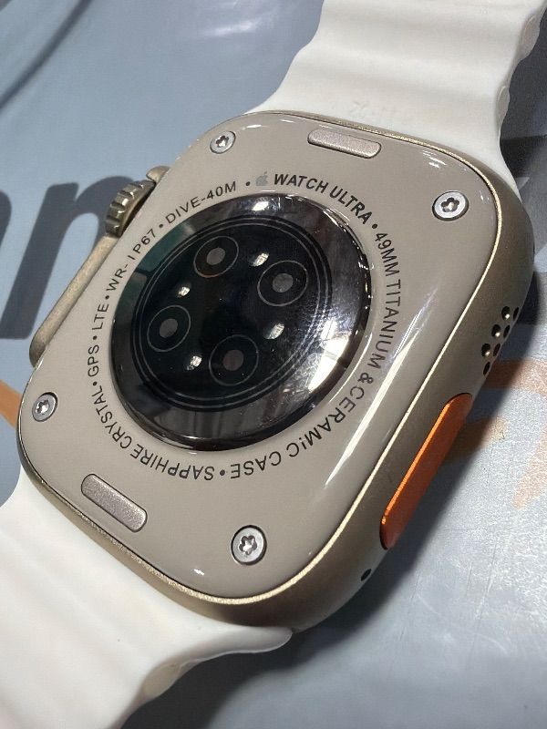 Photo 1 of *Unauthentic* Apple Watch Ultra 2 [GPS + Cellular, 49mm] - Titanium Case With White Ocean Band, One Size (Renewed)