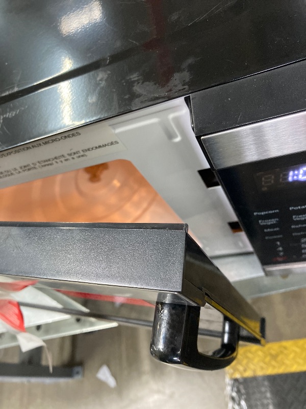 Photo 1 of ***DAMAGED -SELLING NON-FUNCTIONAL AS PARTS ONLY*** Frigidaire Countertop Microwave - Digital Control Panel - 6 Auto Cooking Settings - 10 Power Levels - Child Safety Lock - 0.7 Cu. Ft., Stainless Steel