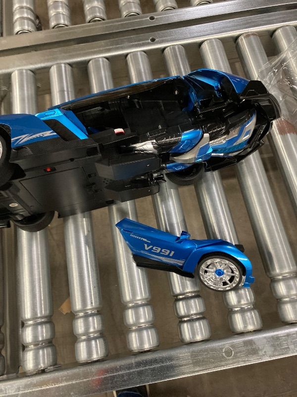 Photo 1 of ***DAMAGED -SELLING AS IS *** Veeniix V991 Transform Remote Control Car, 1:10 Big Size, 2 Rechargeable Batteries for 70Min, 2.4GHz Gesture Sensing, One-Key Deformation, Robot Toys Gifts for Boys and Girls (Blue)
